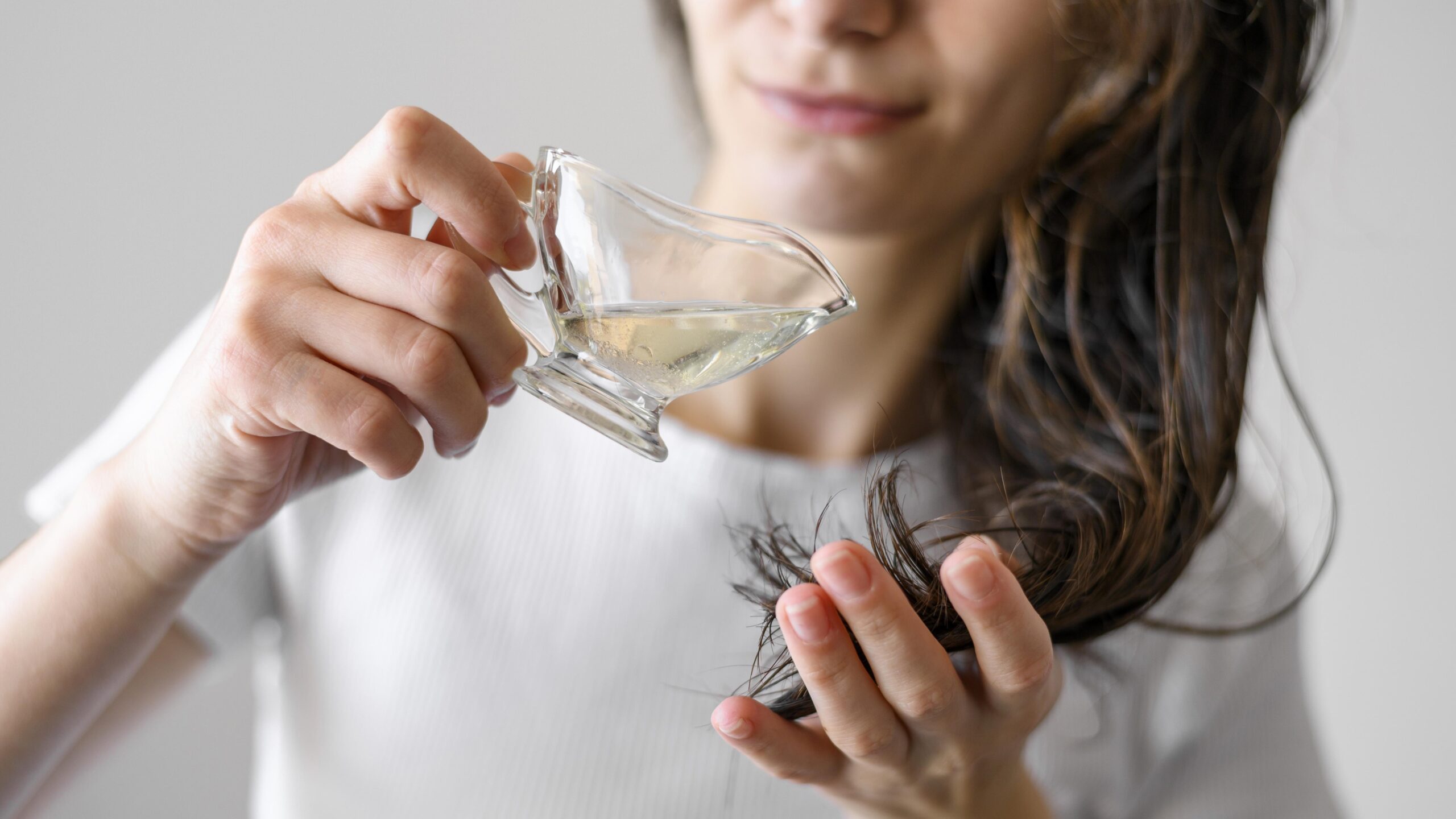 close-up-woman-with-serum-hair protection-mawebzine-blog