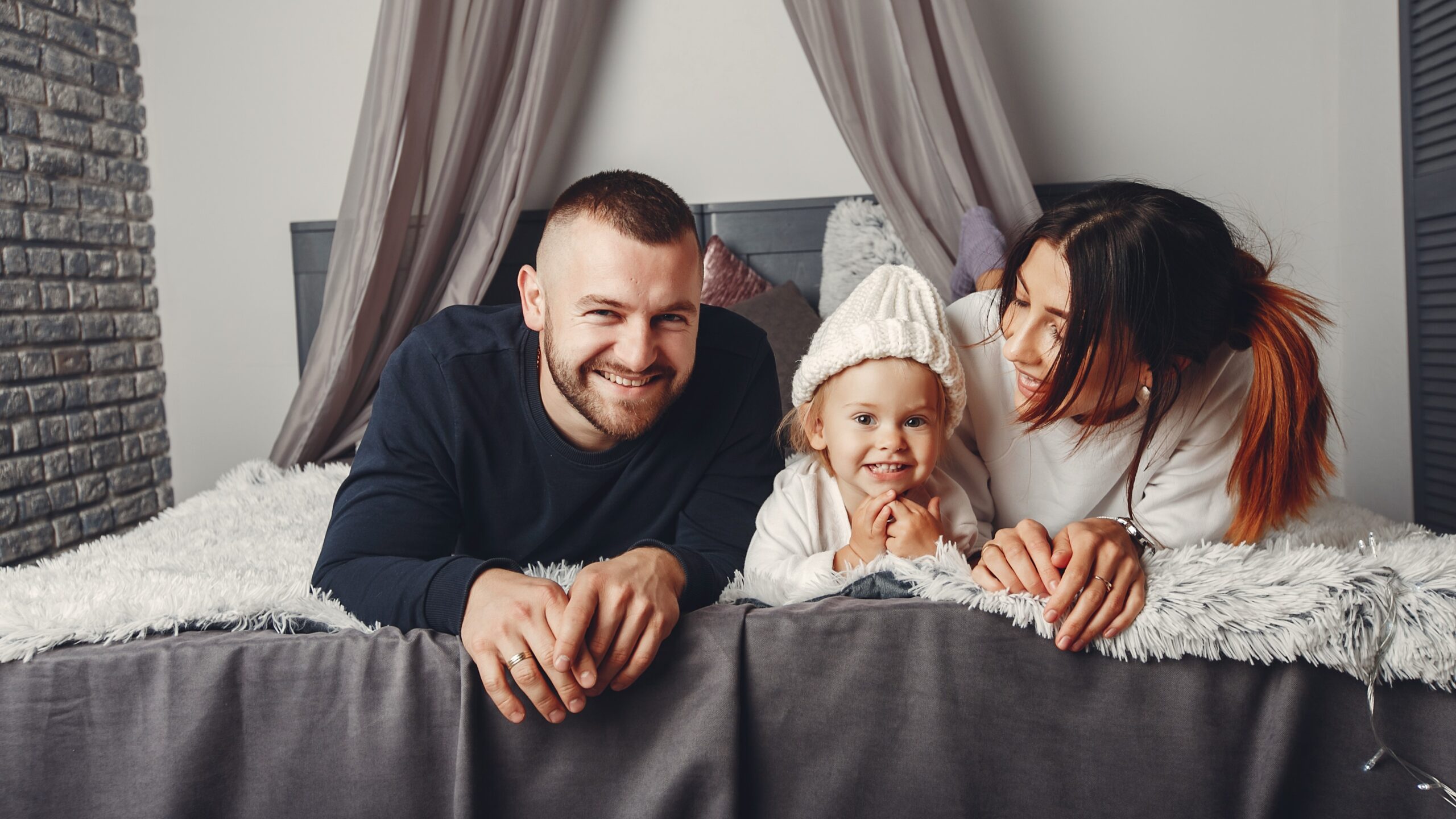 Father and mother with little daughter