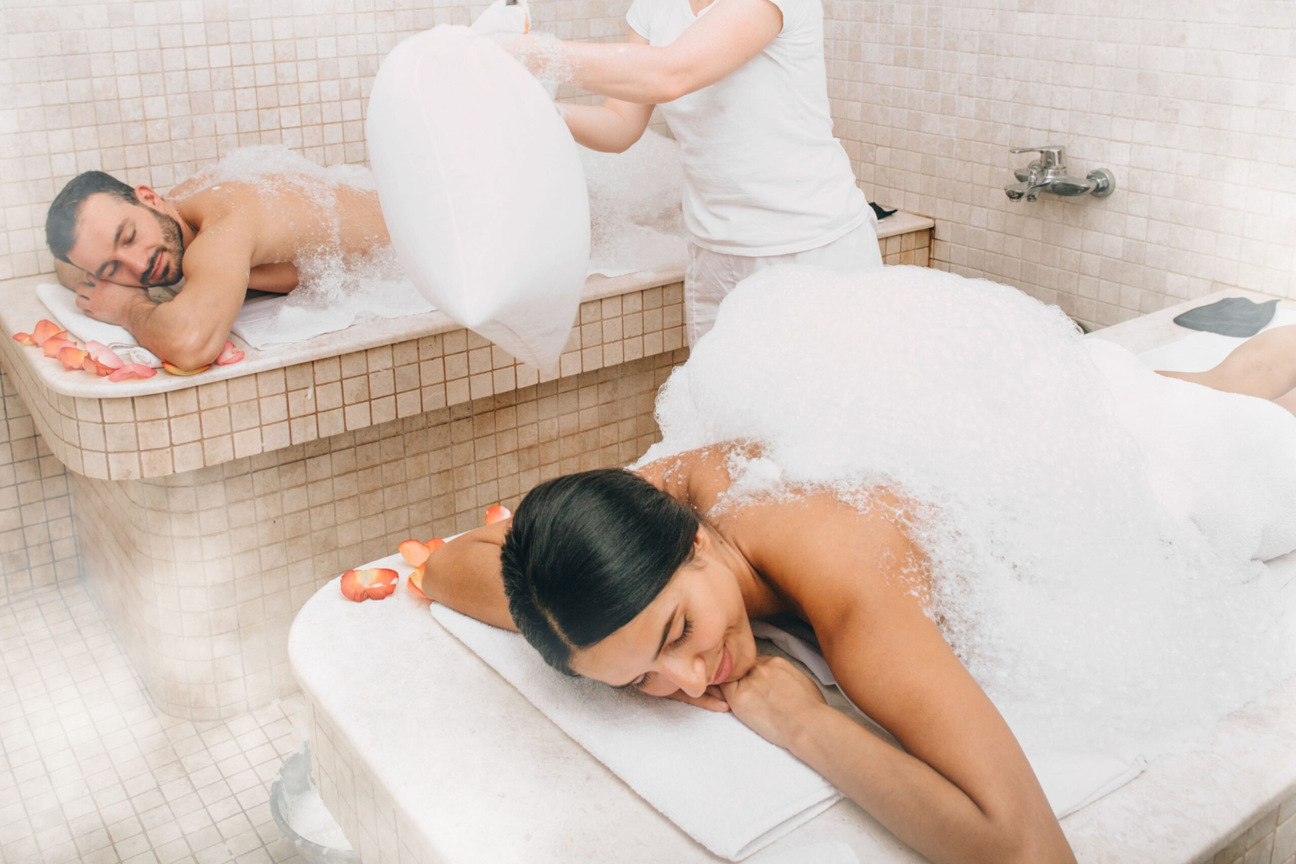 Authentic testimonial hammam experience showing woman and man enjoying traditional Moroccan steam therapy and wellness transformation