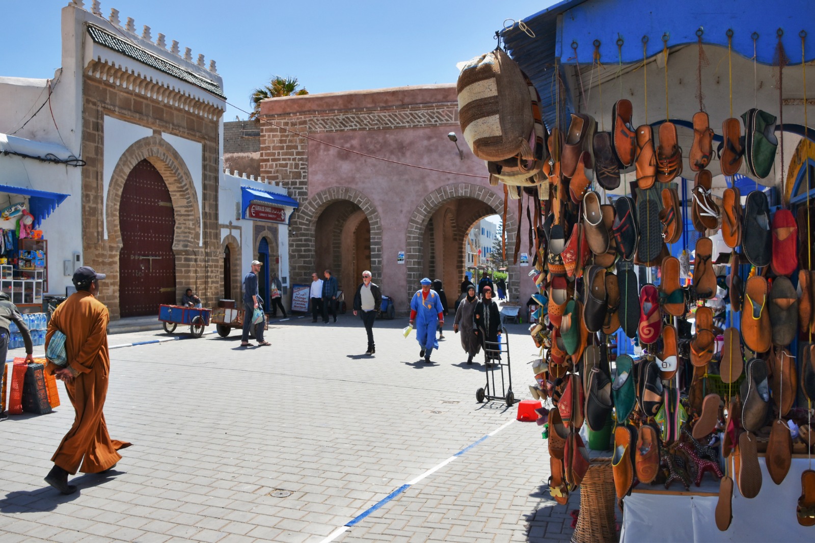 Expats exploring a colorful medina street during their first weeks of moving to Morocco