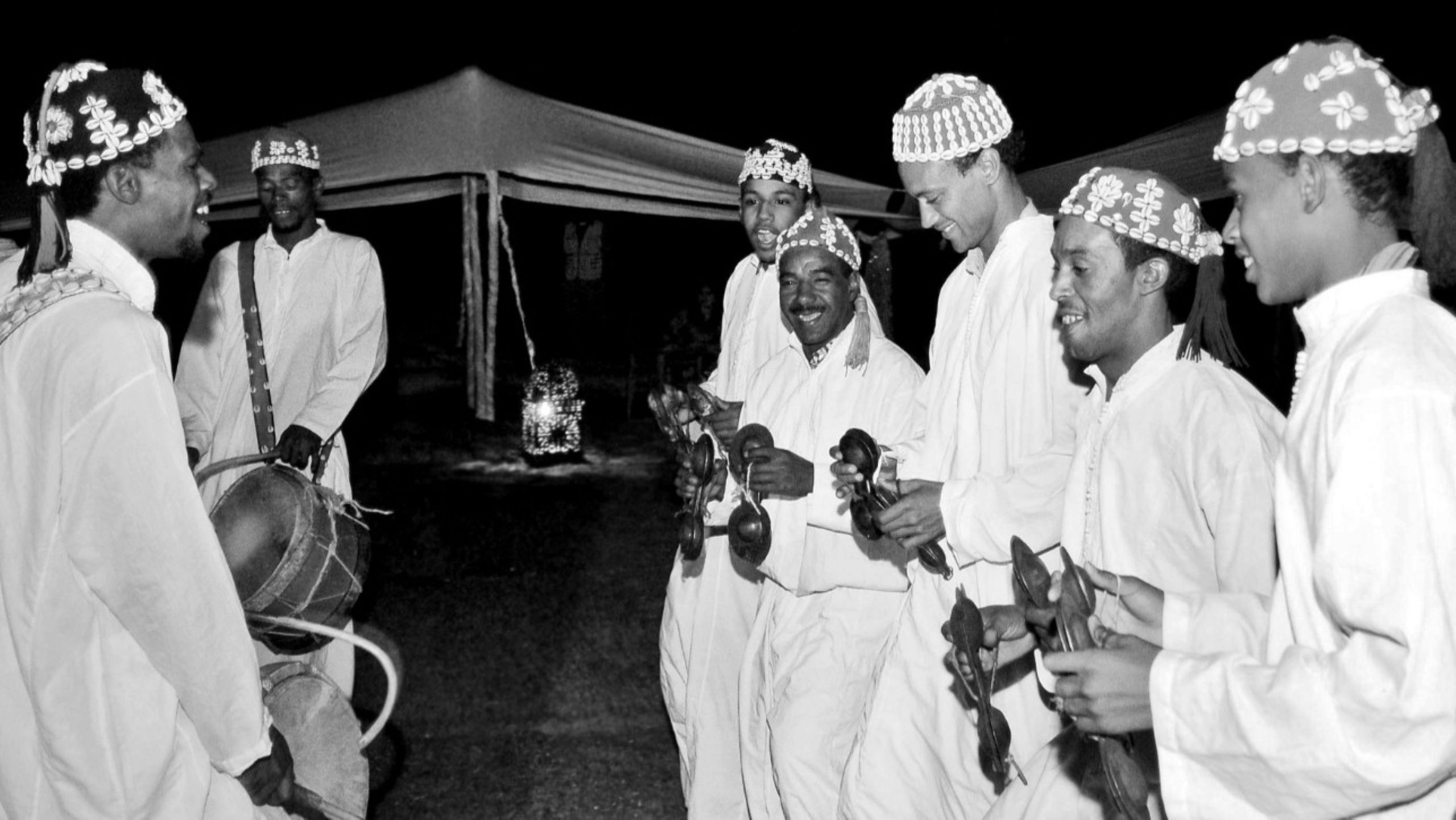 Crowd gathering at the main stage on Place Moulay Hassan during the Gnaoua Festival Essaouira at night