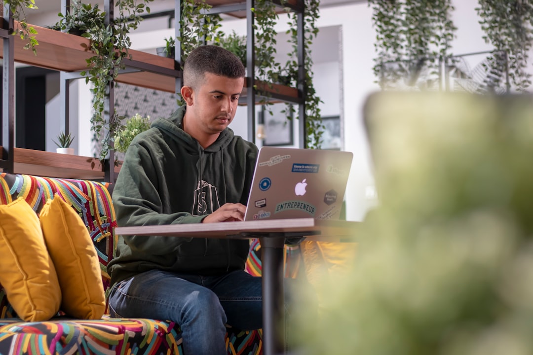 An entrepreneur at a desk in an Agadir coworking space, illustrating Morocco's Atlantic coast digital nomad community