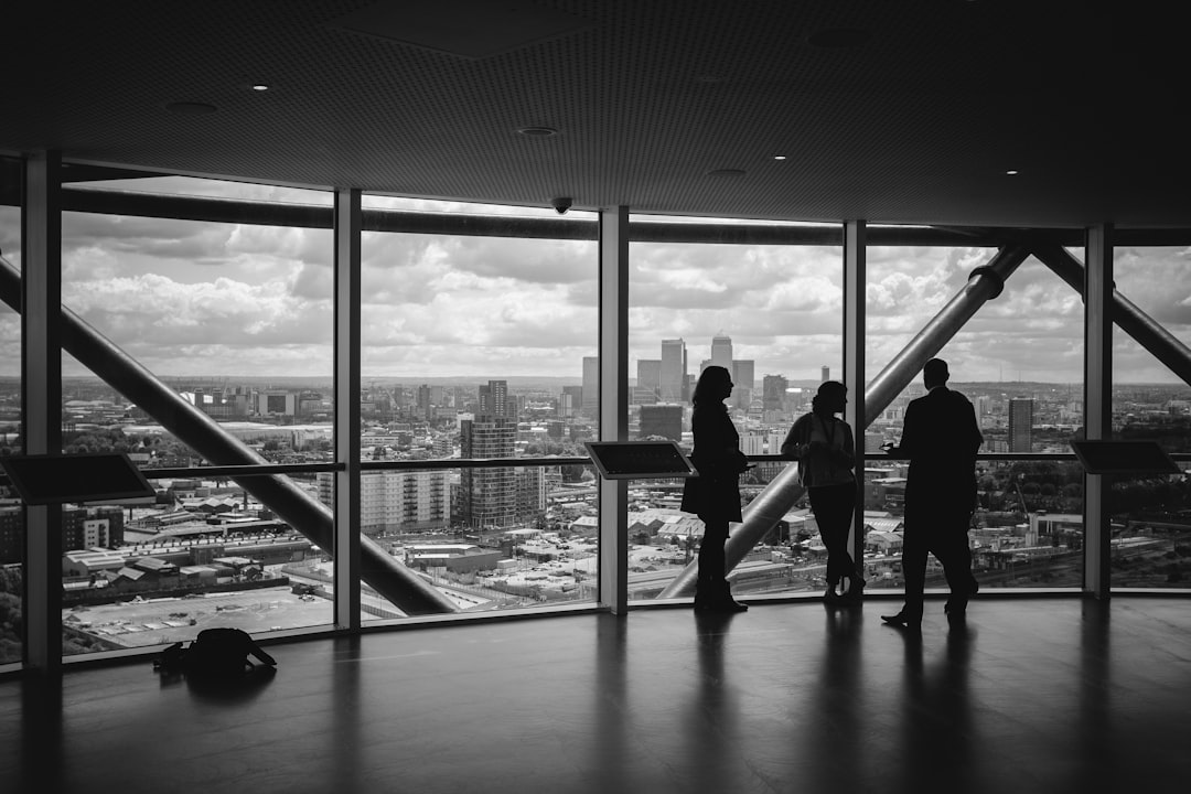 An entrepreneur in Casablanca reviews documents on rooftop terrace,representing business momentum behind June Morocco travel.