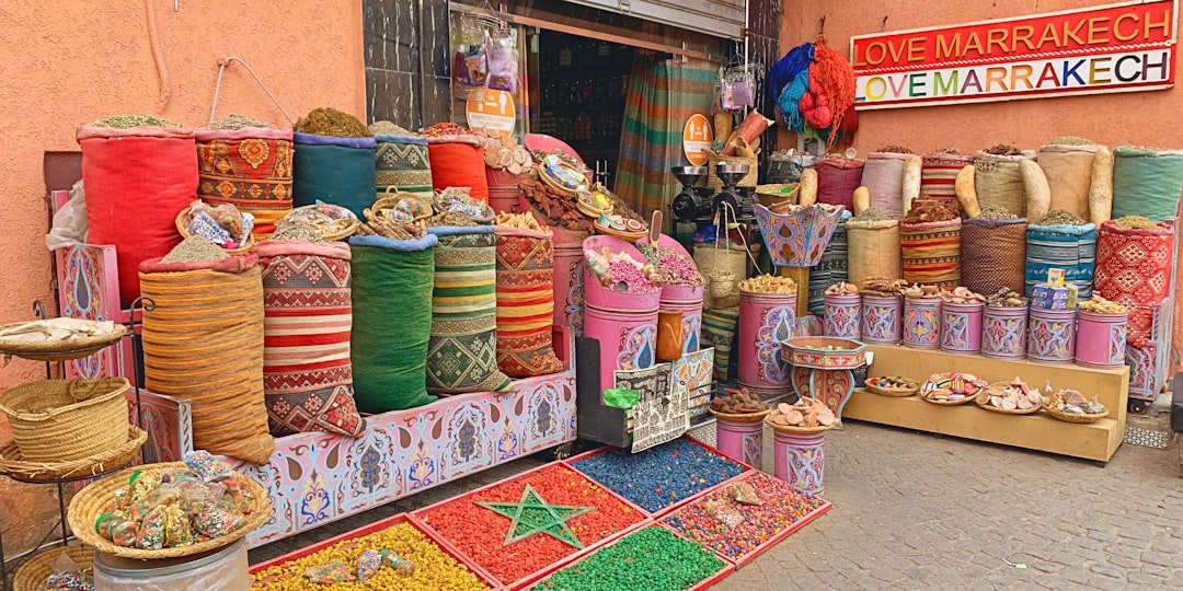 A chef selects aromatic spices at a Moroccan market to prepare an authentic Moroccan tagine.