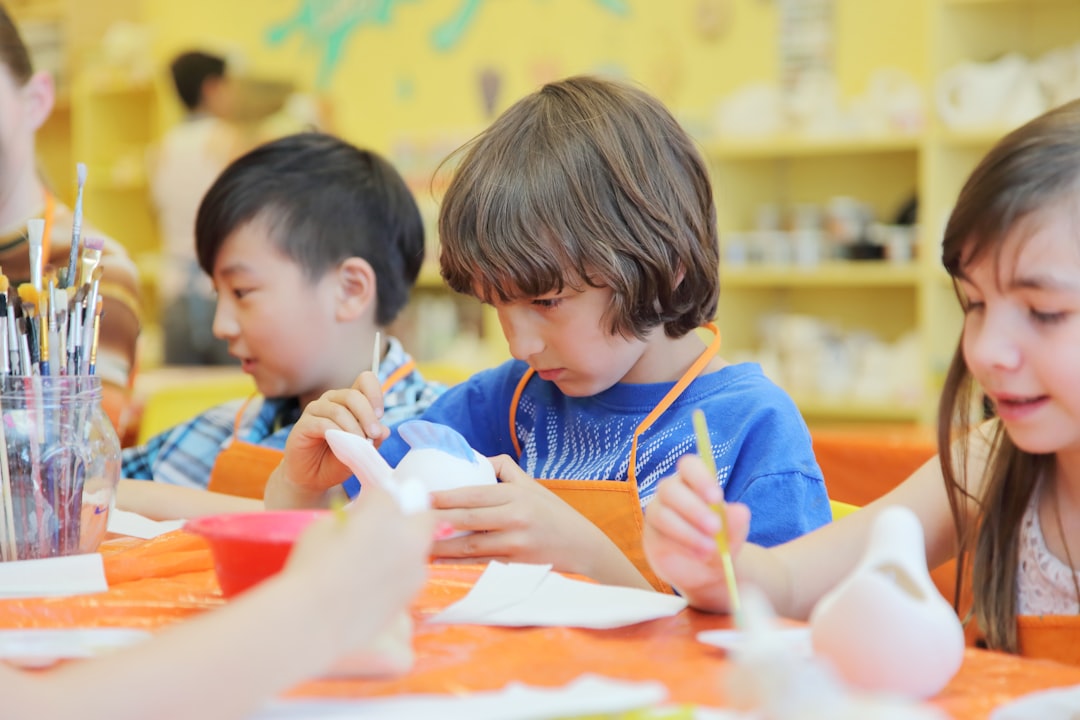 children pottery in a cool indoor workshop space, best activities to keep kids cool during Morocco's hottest midday hours.