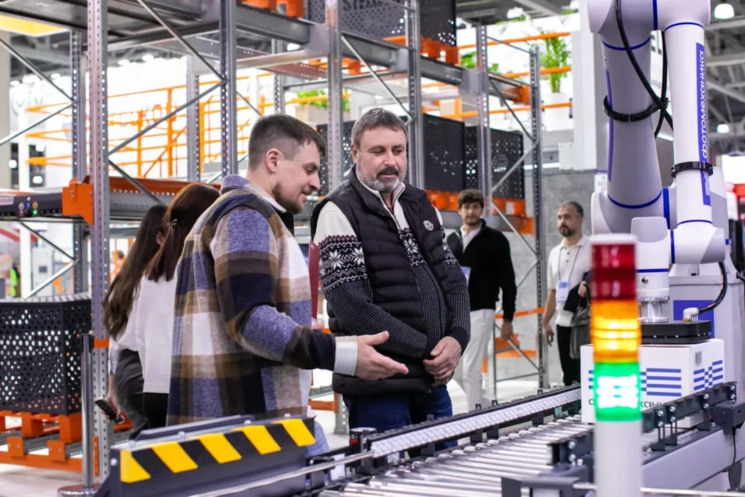 An entrepreneur discusses logistics strategy inside a warehouse connected to the Tangier Med free zone network