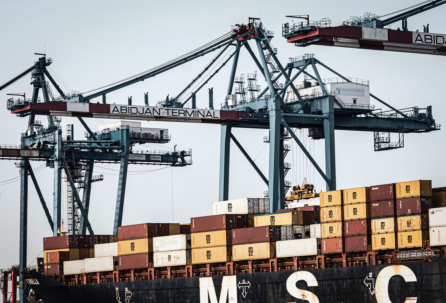An entrepreneur discussing trade logistics at a Moroccan port facility, reflecting the infrastructure backbone of Morocco business and its role as a gateway between Europe and Africa