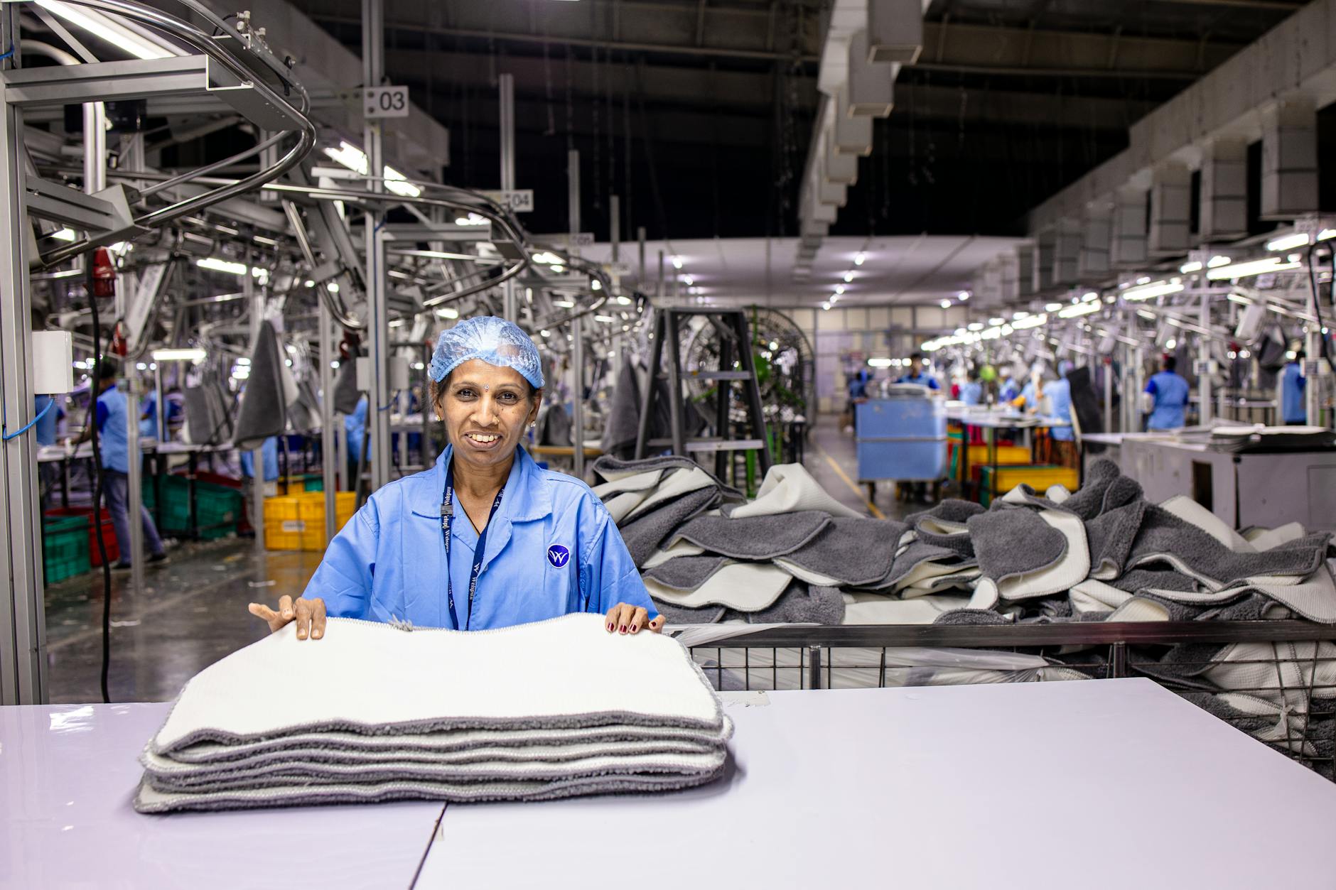 A manufacturing worker on an automotive assembly line in Morocco, illustrating the industrial strength driving Morocco business exports