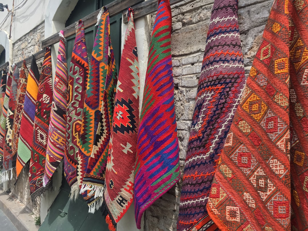 Women in a Moroccan cooperative sort and prepare handwoven textiles made from natural wool and plant-based dyes.