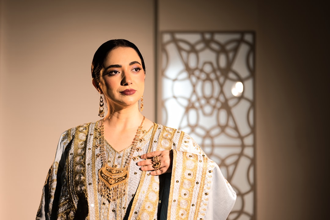 A Moroccan woman in a handwoven summer caftan representing the beauty of slow Moroccan fashion in natural light.