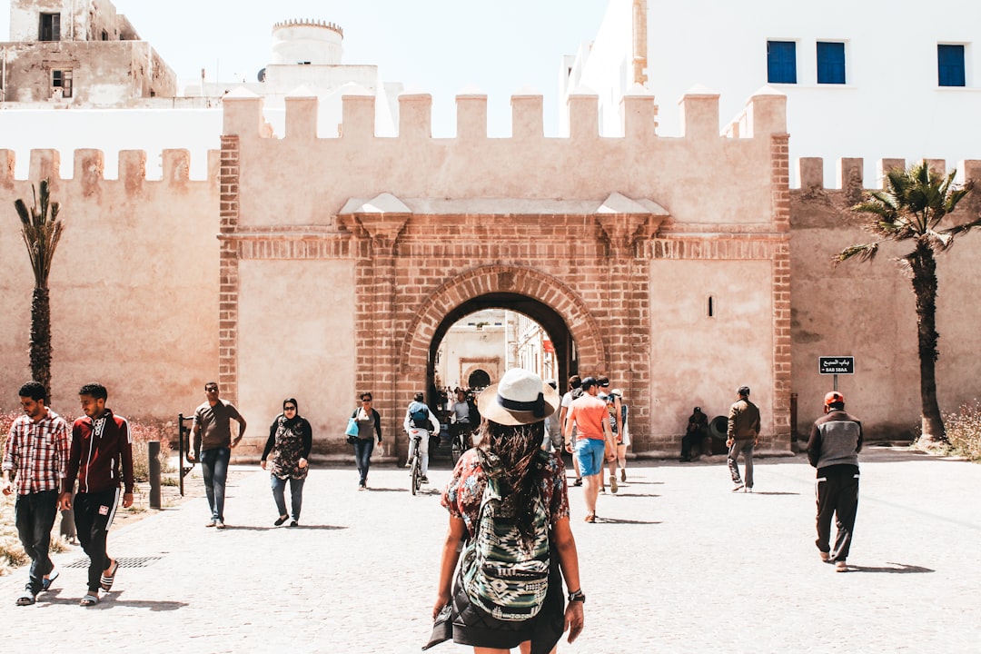 A traveler walks through the medina of Essaouira during the Gnaoua festival week
