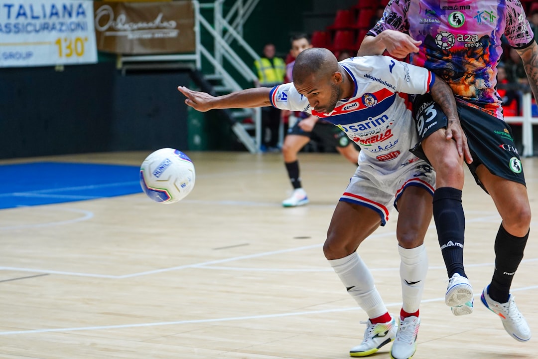 A Moroccan handball player celebrates during an African handball championship match in front of a passionate crowd