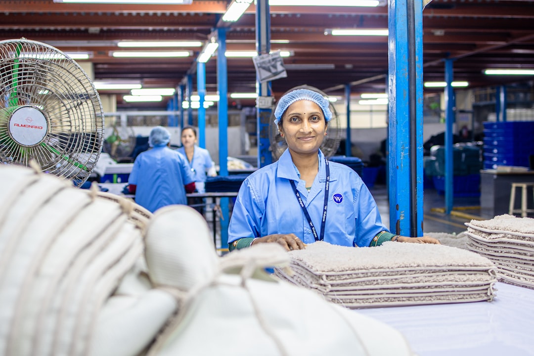 A Moroccan woman works on an automotive assembly line, reflecting the industrial growth highlighted in the Throne Day speech