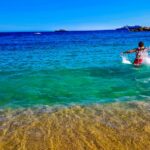 A swimmer glides through the calm turquoise water during open water swimming on Morocco's Mediterranean coast near Al Hoceima