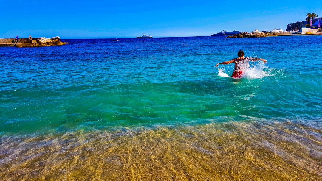 A swimmer glides through the calm turquoise water during open water swimming on Morocco's Mediterranean coast near Al Hoceima