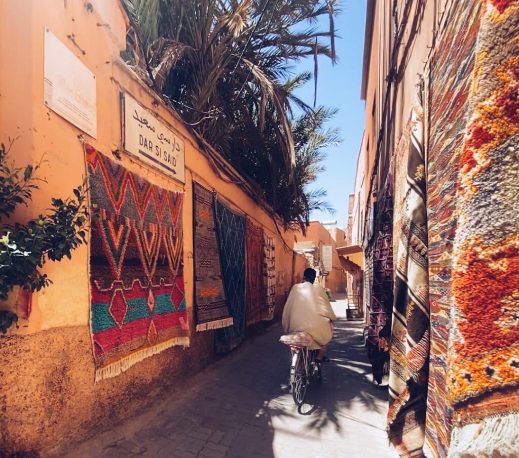 A craftsman works leather goods inside a souk in one of Morocco's historic medinas during the autumn season