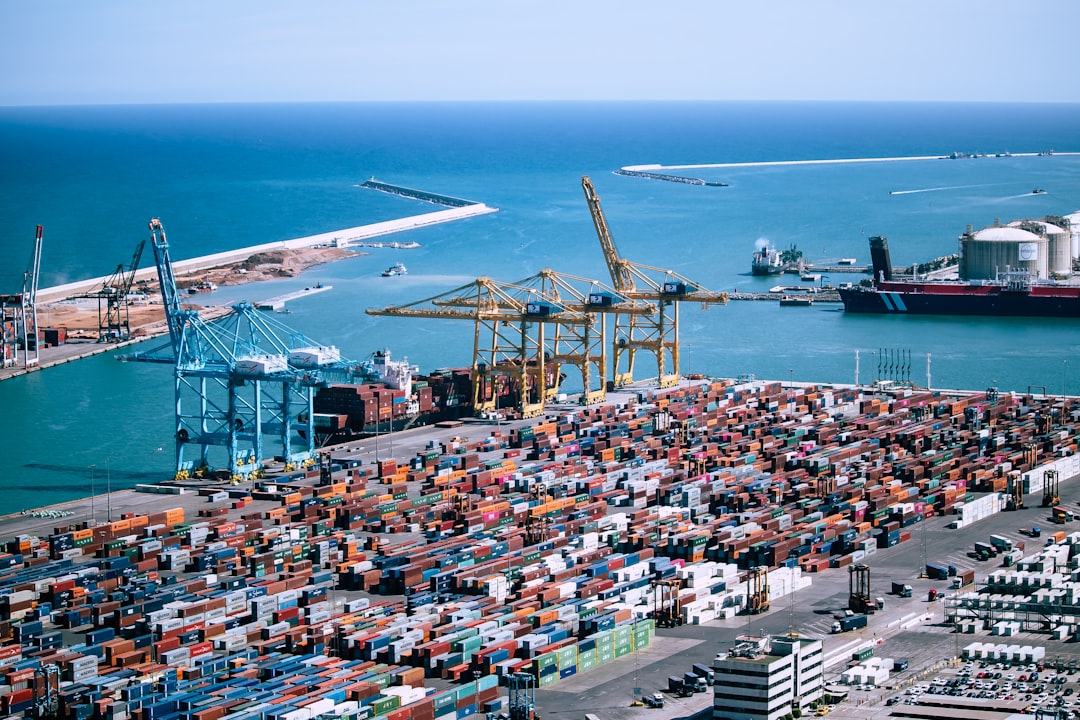 A freight logistics worker inspects containers at Tanger Med port, where post-summer freight demand peaks each autumn