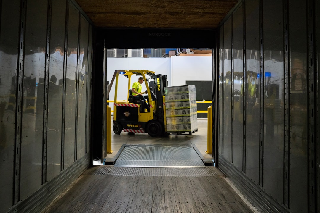 A truck driver loads refrigerated cargo bound for Europe, part of the seasonal freight demand surge at Tanger Med