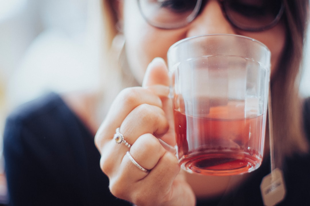 A Moroccan woman relaxing with herbal mint tea after completing her hammam reset ritual at home