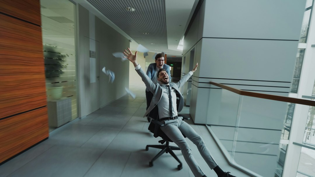 Woman practising breathing techniques in a quiet office hallway before a meeting